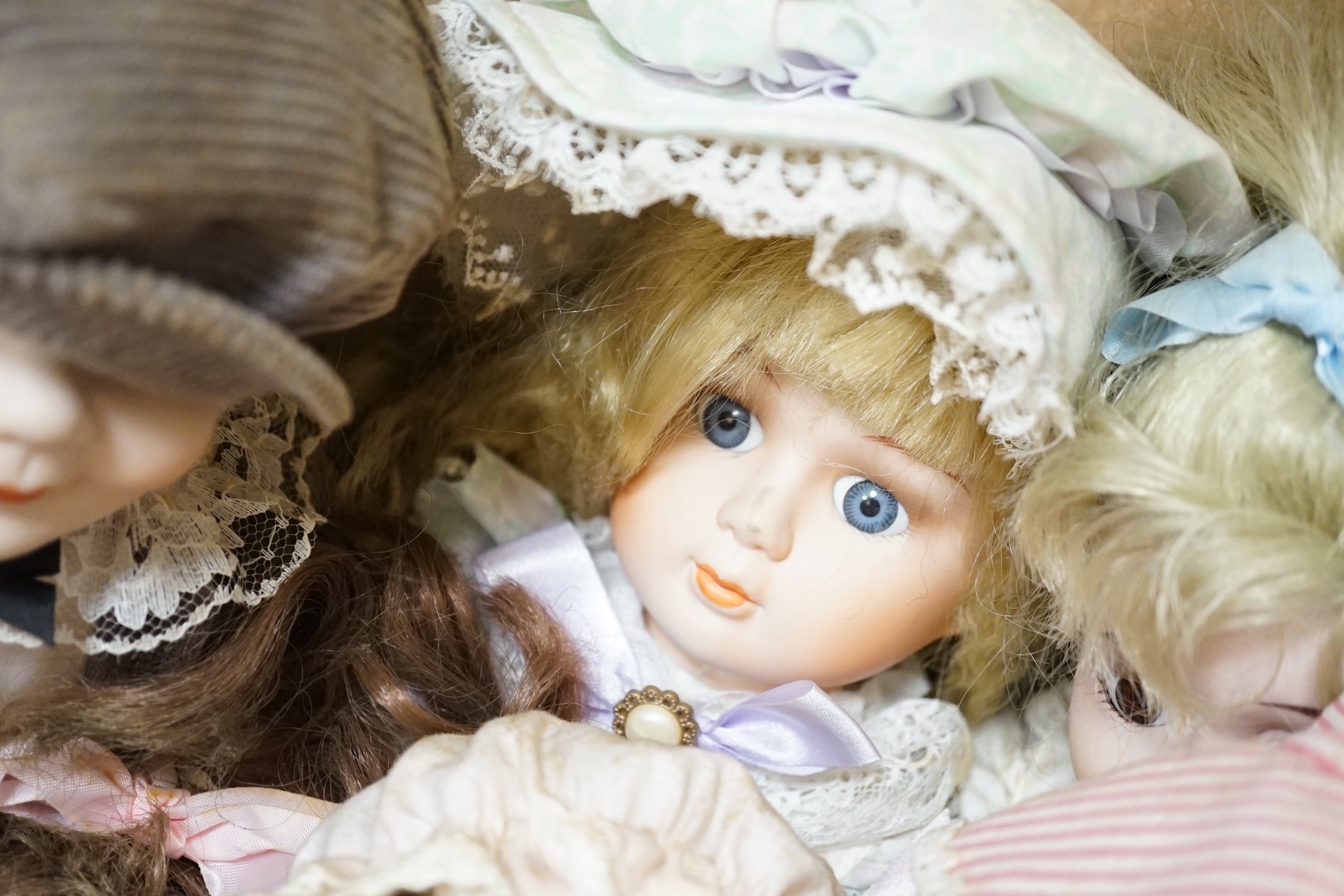 A quantity of various dolls